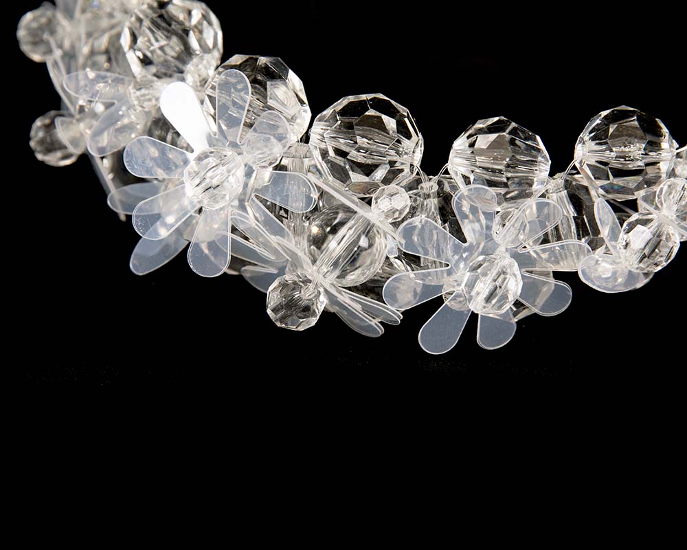 White designers headband by Max Alexander