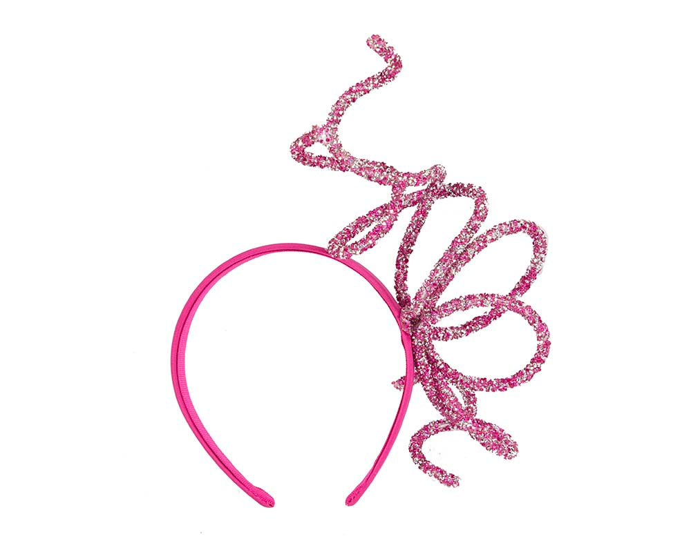 Bespoke sculptured fuchsia fascinator by Cupids Millinery