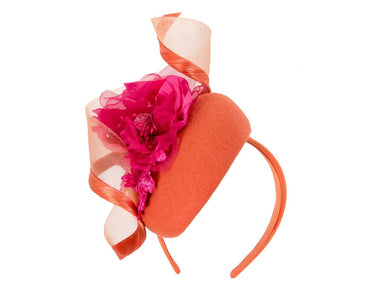 Orange winter pillbox fascinator with fuchsia flower