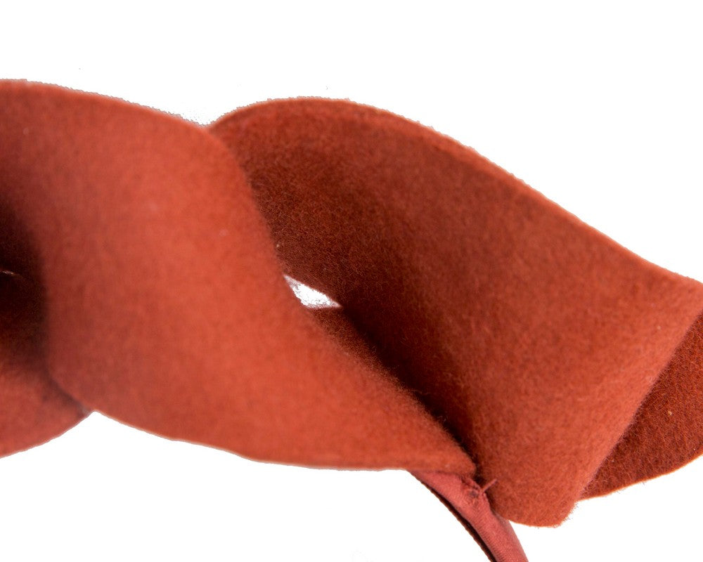Twisted orange felt winter racing fascinator by Max Alexander