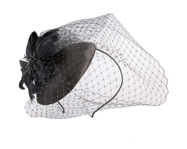 Black fascinator with feather and veil