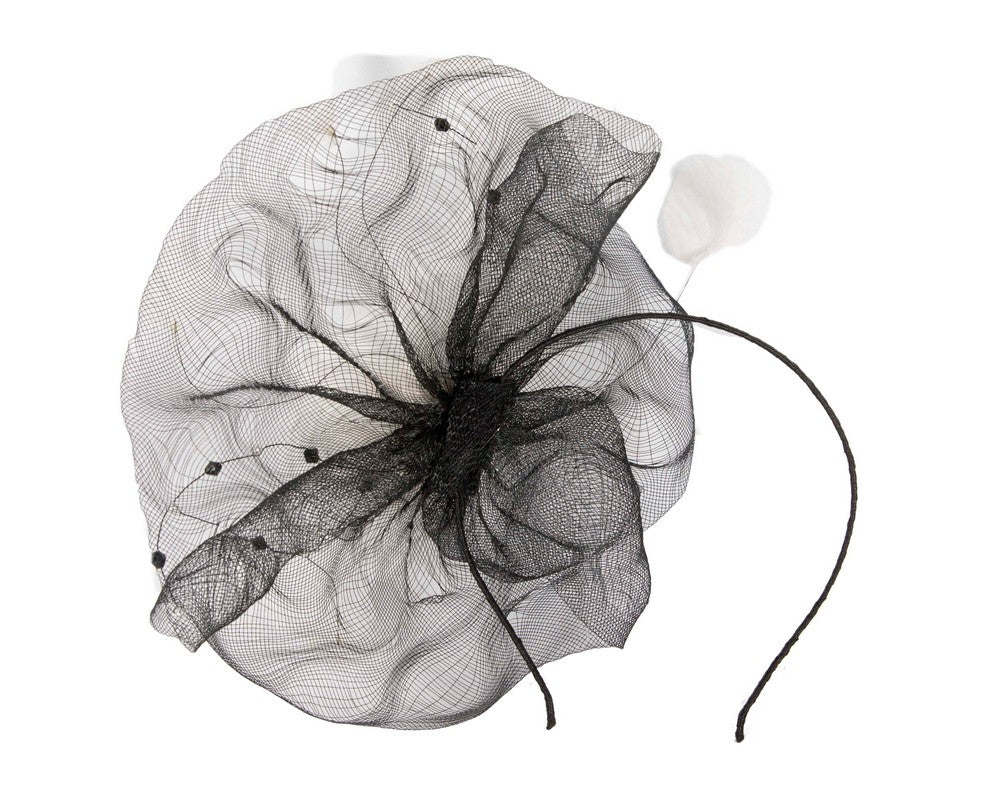 Large black fascinator with white flower