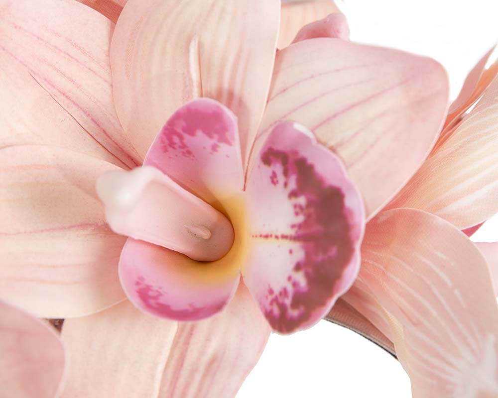 Bespoke coral pink orchid flower headband by Cupids Millinery