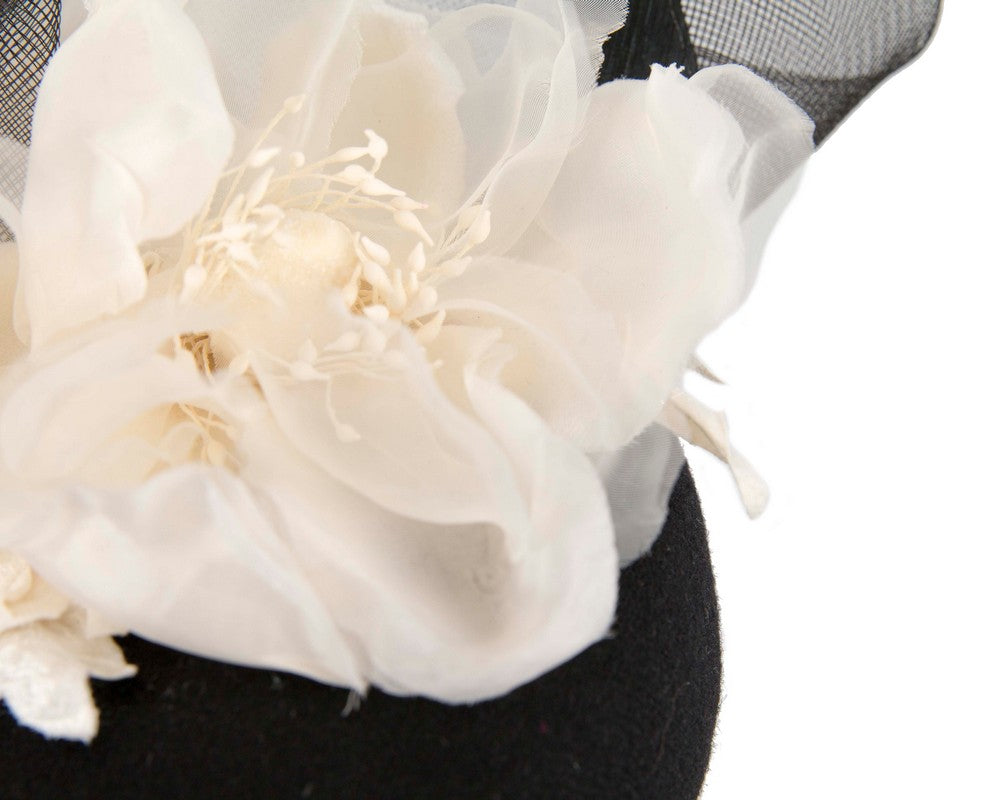Black winter pillbox fascinator with white flower