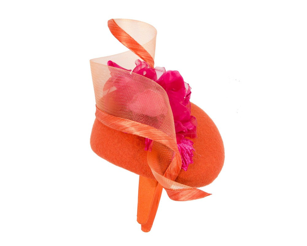 Orange winter pillbox fascinator with fuchsia flower