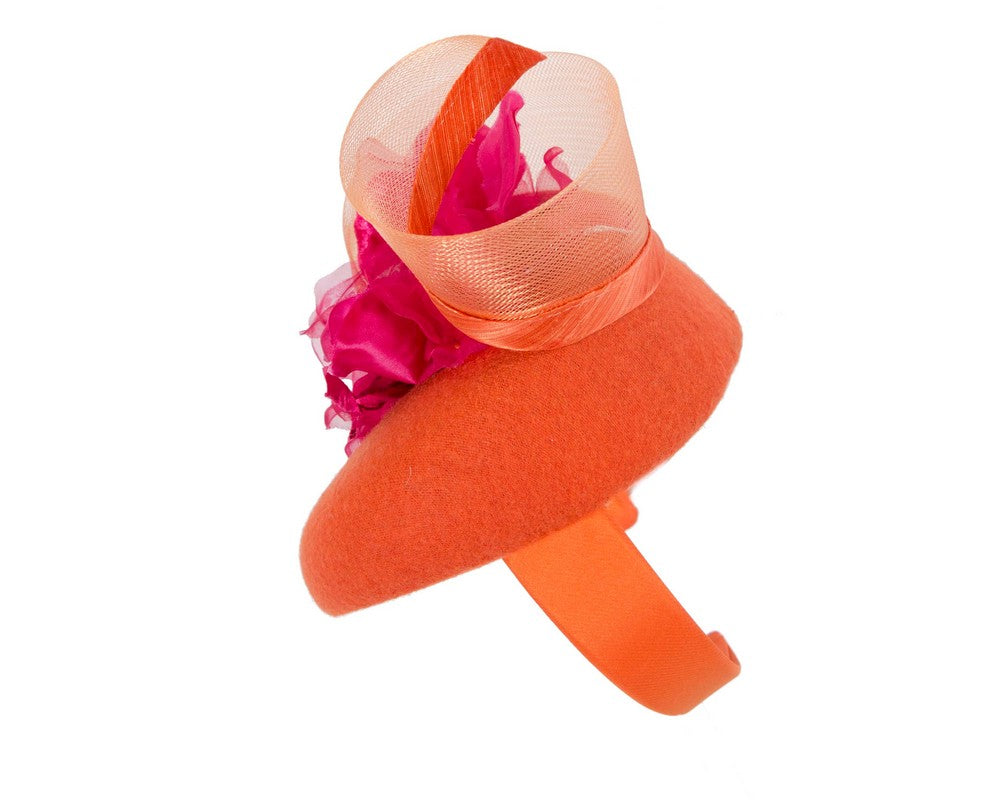 Orange winter pillbox fascinator with fuchsia flower