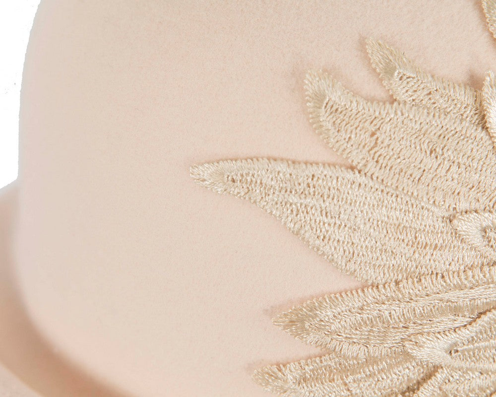 Beige winter fashion hat by Max Alexander