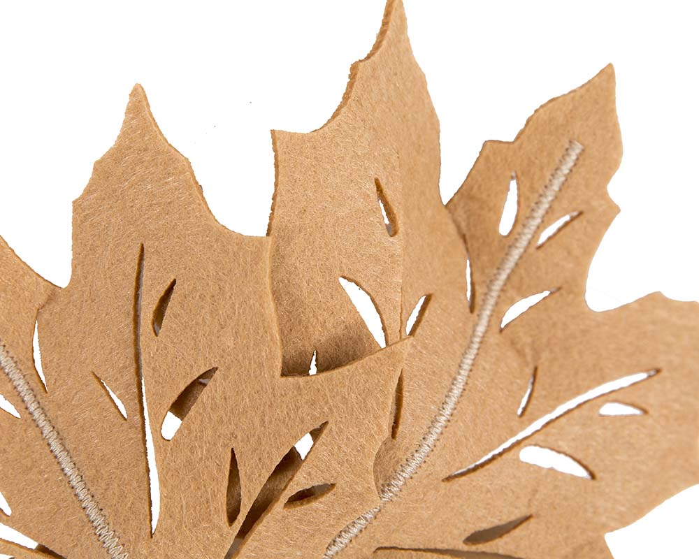 Beige laser cut maple leafs on headband