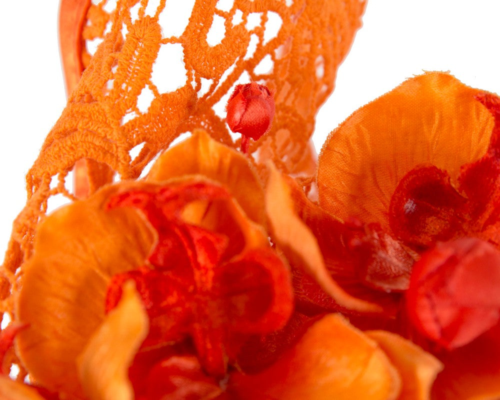 Orange lace covered pillbox fascinator