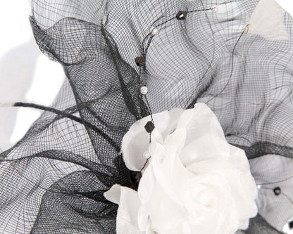 Large black fascinator with white flower