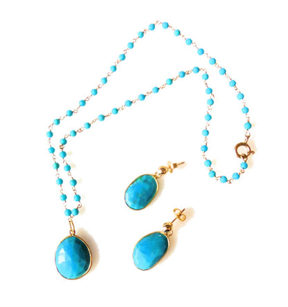 Turquoise pendant on beaded twisted wire necklace.